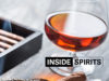 Inside Spirits whisky shot and cigar smoke