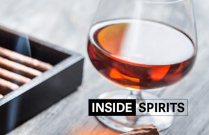 Inside Spirits whisky shot and cigar smoke